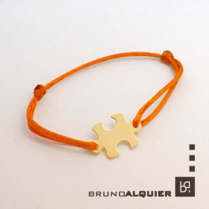 Bruno Alquier - Bracelet PUZZLE en or jaune sur cordon